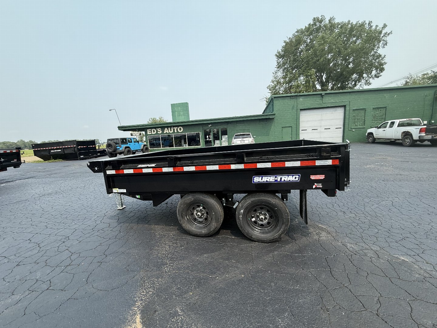 New 2025 Sure-Trac 6x10 DECKOVER 7K Dump Trailer